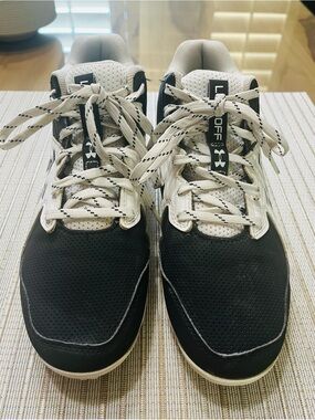 Under Armour Black and White SZ 6.5 Big Boy cleats. Baseball, football, rugby